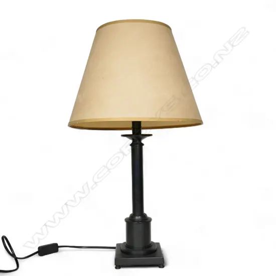 A table lamp and shade,